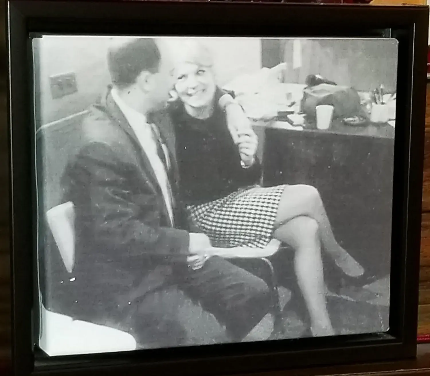 Vintage black-and-white photograph of the Ames family at the firm's early office